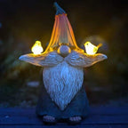 A fun, decorative solar-powered bird garden statue made from durable resin.