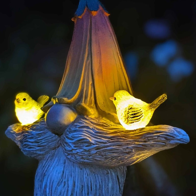 A fun, decorative solar-powered bird garden statue made from durable resin.